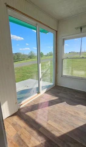 a view of an empty room and window