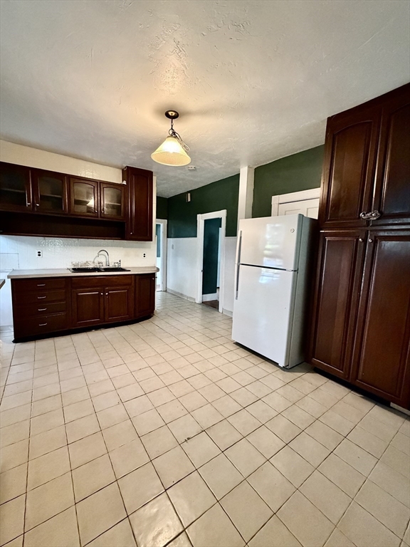 1 Congress Street, Unit 1 Worcester, MA 01609 - Photo 6 of 10 a kitchen with stainless steel appliances a refrigerator and a stove top oven