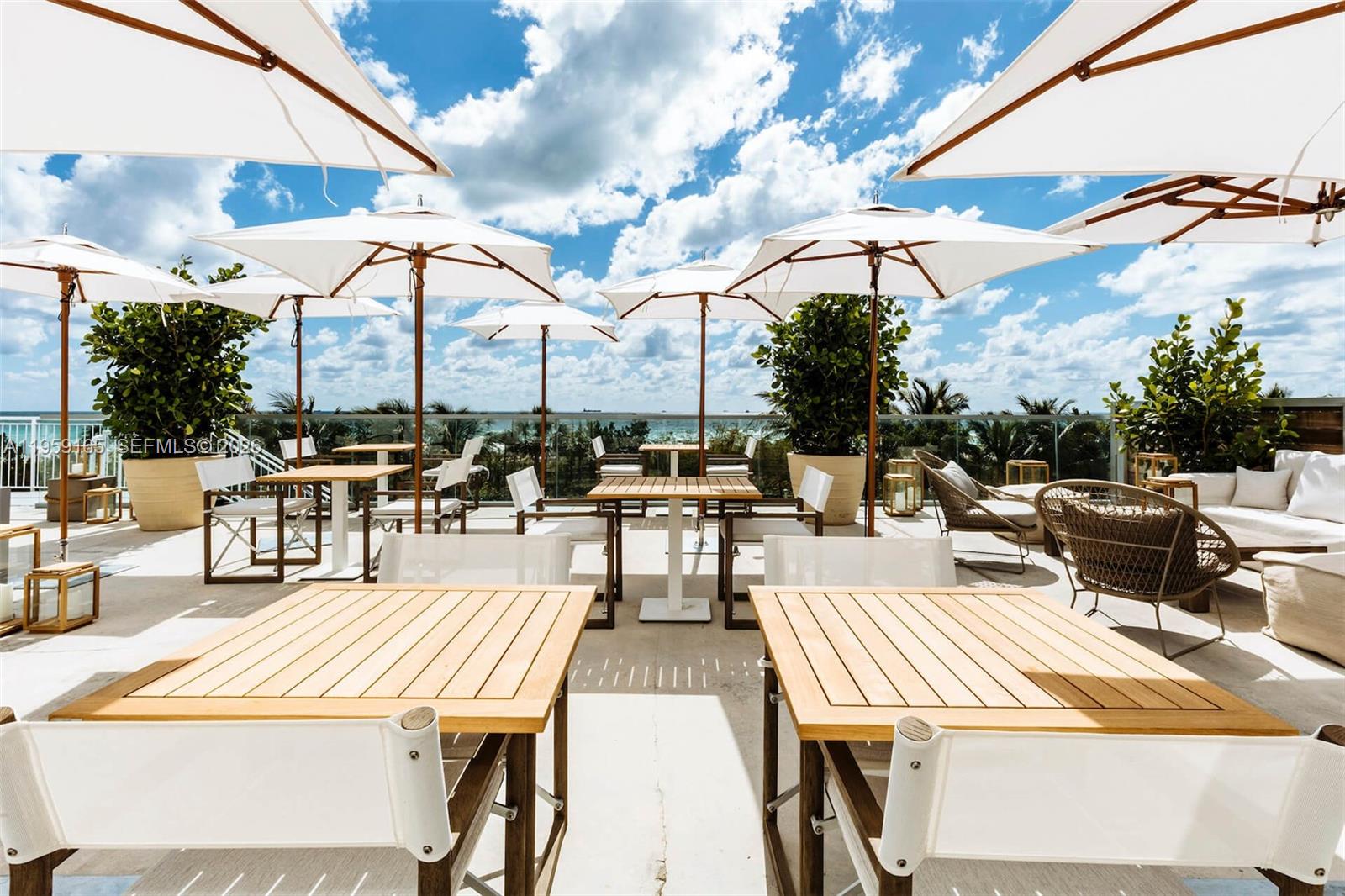 102 24th Street, Unit 1007 Miami Beach, FL 33139 - Photo 15 of 23 a outdoor space with lots of tables and chairs