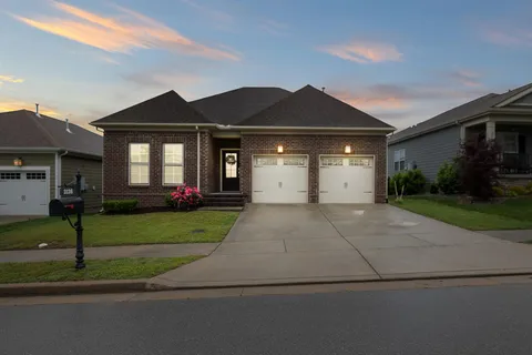 a balcony with furniture and a floor to ceiling window