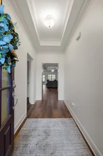 a kitchen with granite countertop kitchen island stainless steel appliances a sink stove and cabinets