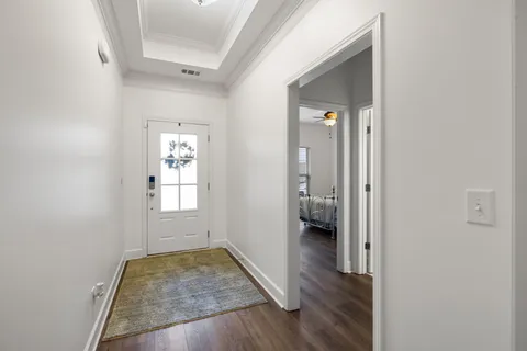 a view of kitchen and kitchen with wooden floor