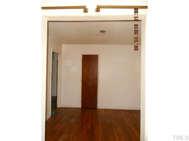 536 Dacian Road Raleigh, NC 27610 - Photo 7 of 10 a view of a hallway with wooden floor