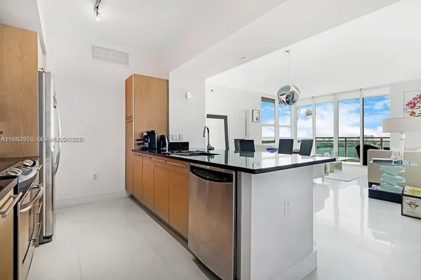 a kitchen with counter top space and appliances