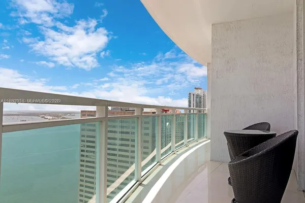 a view of balcony with furniture