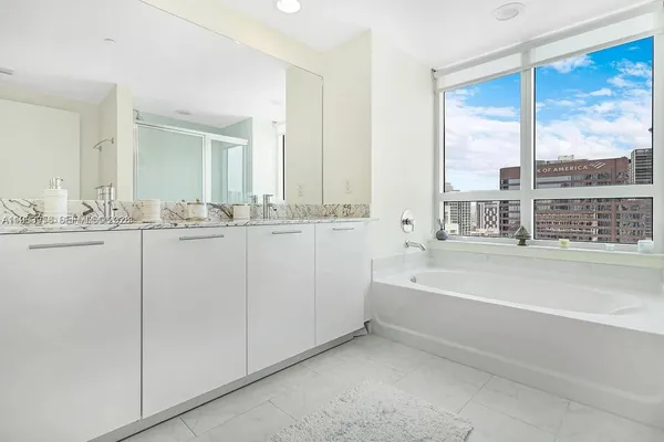 a bathroom with a bathtub and a sink