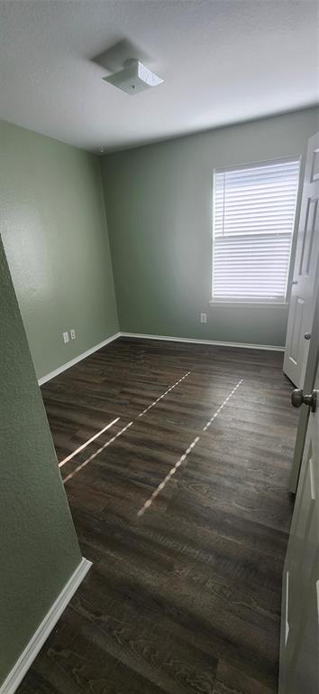 3709 Northpointe Drive Denton, TX 76207 - Photo 13 of 29 a view of room with window and hardwood floor