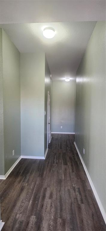 3709 Northpointe Drive Denton, TX 76207 - Photo 5 of 29 an empty room with wooden floor and windows