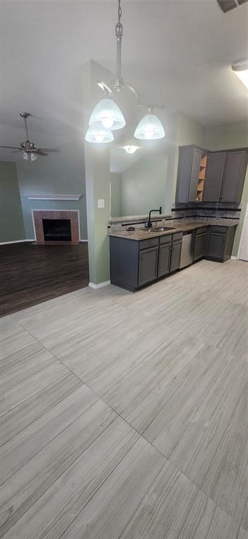 3709 Northpointe Drive Denton, TX 76207 - Photo 29 of 29 a large room with a chandelier and fireplace