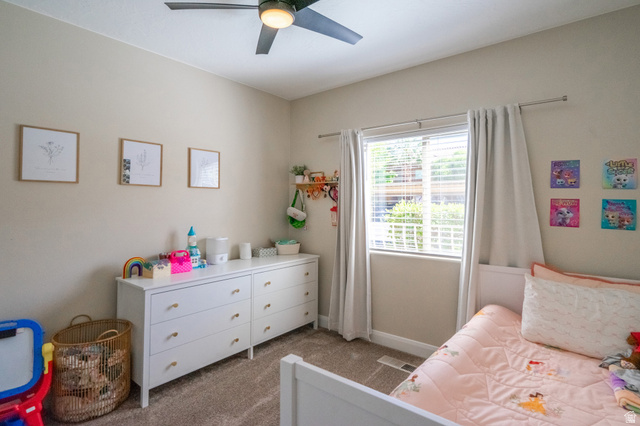 700 North Main Street, Unit F3 Washington, UT 84780 - Photo 23 of 34 Bedroom featuring neutral wall paint, a window with blinds, and a ceiling fan with integrated lighting