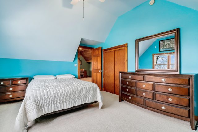 40W639 Russell Road Elgin, IL 60124 - Photo 29 of 59 a bedroom with a bed and a dresser