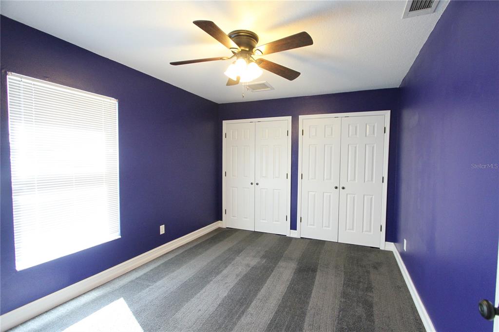 1414 Norwick Drive Lutz, FL 33559 - Photo 26 of 43 a view of room with window and ceiling fan