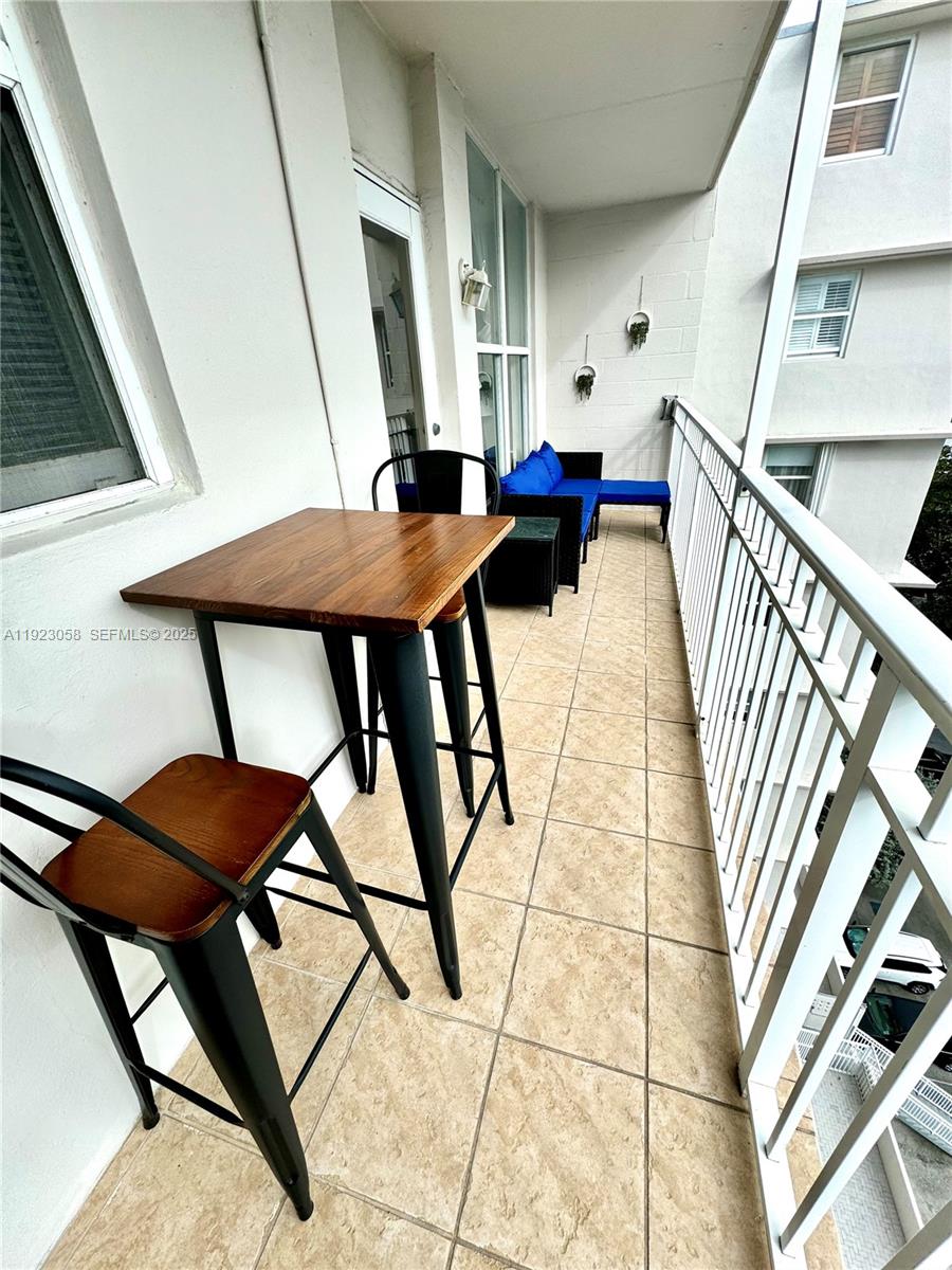 1300 Lincoln Road, Unit C903 Miami Beach, FL 33139 - Photo 10 of 13 a view of an outdoor space with seating area