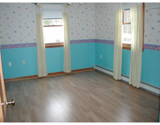347 Boston Road Chelmsford, MA 01824 - Photo 3 of 11 an empty room with wooden floor and windows