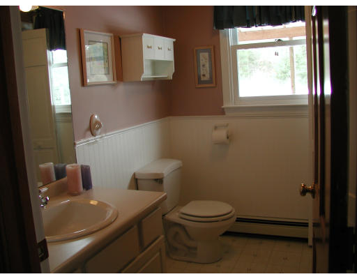 347 Boston Road Chelmsford, MA 01824 - Photo 6 of 11 a bathroom with a toilet a sink and a window