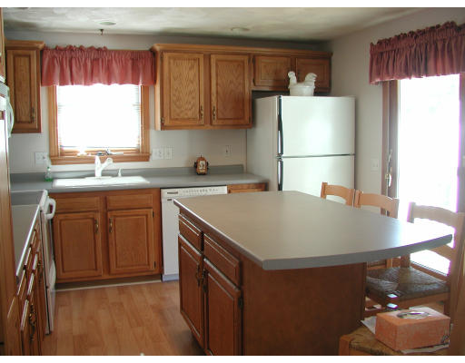 347 Boston Road Chelmsford, MA 01824 - Photo 9 of 11 a kitchen with a sink a refrigerator and window
