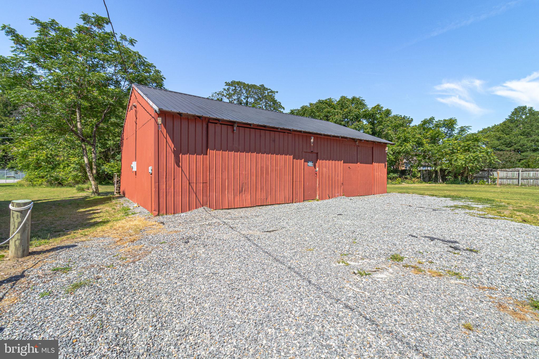 9832 River Road Lancaster, VA 22503 - Photo 60 of 68 Charming red barn on a gravel lot.