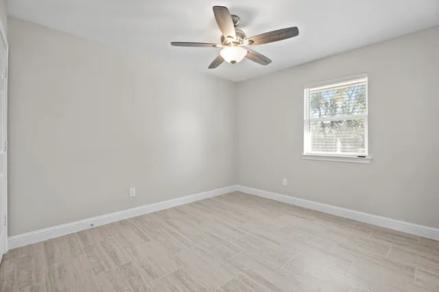 a view of an empty room with a window