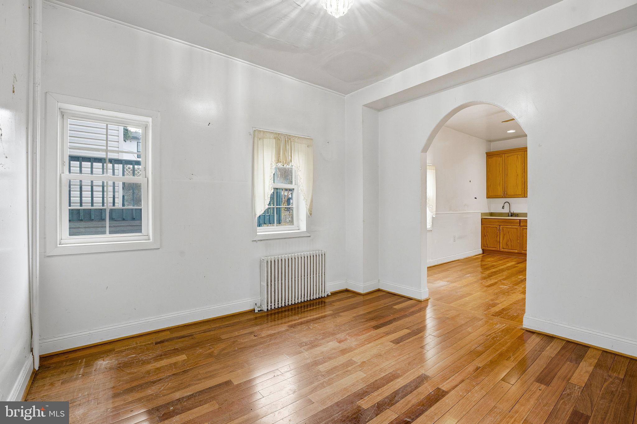 1346 Franklin Street Northeast Washington, DC 20017 - Photo 11 of 50 a view of empty room with wooden floor and fan