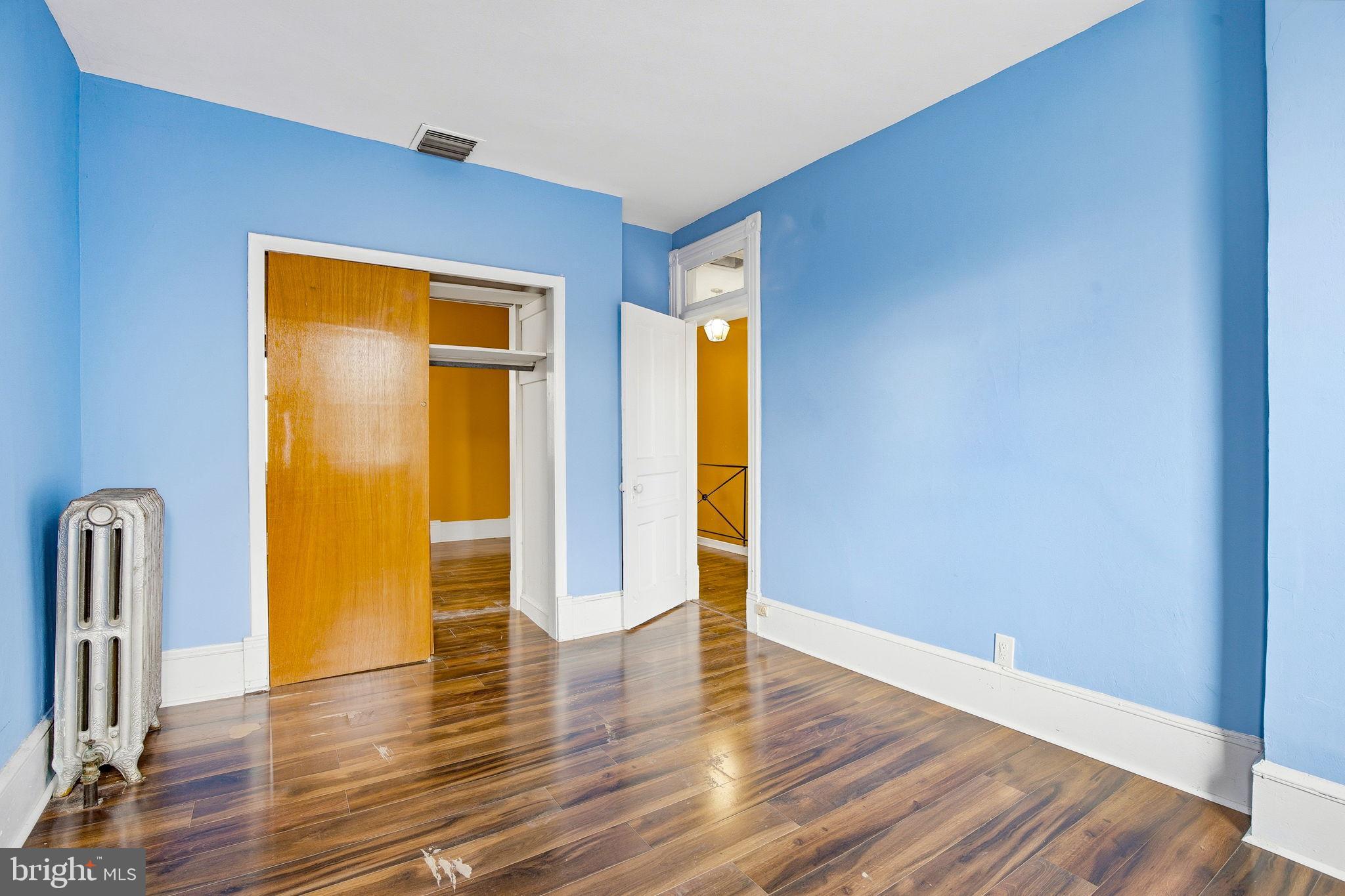 1346 Franklin Street Northeast Washington, DC 20017 - Photo 21 of 50 a view of an empty room with wooden floor and a window