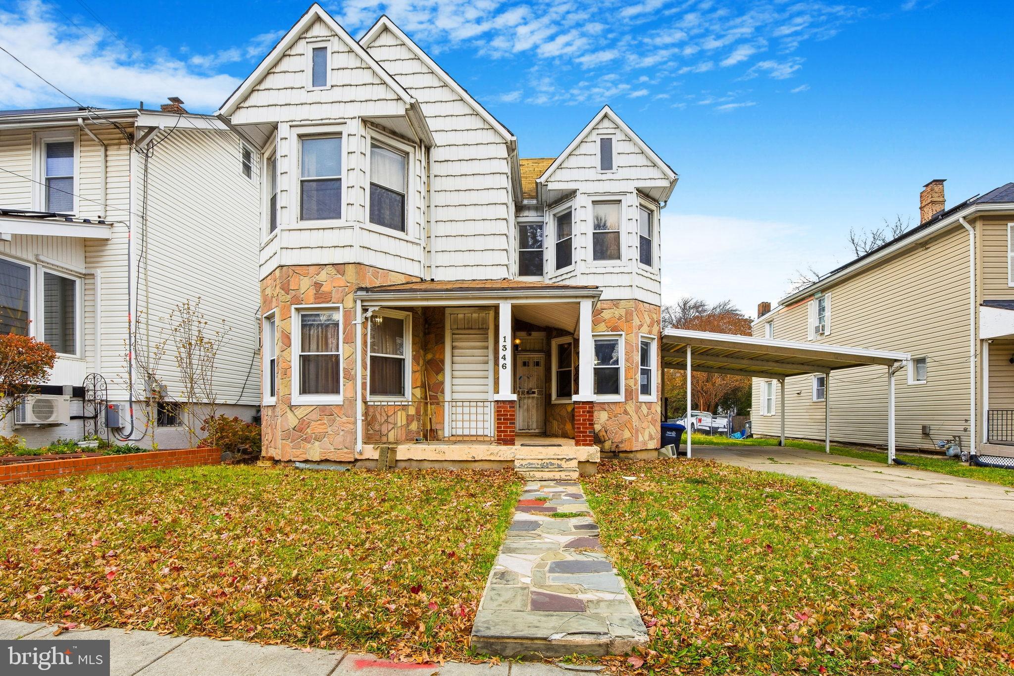 1346 Franklin Street Northeast Washington, DC 20017 - Photo 33 of 50 a front view of a house with a yard
