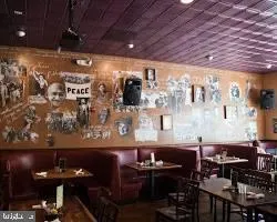 a view of a dining room with many windows