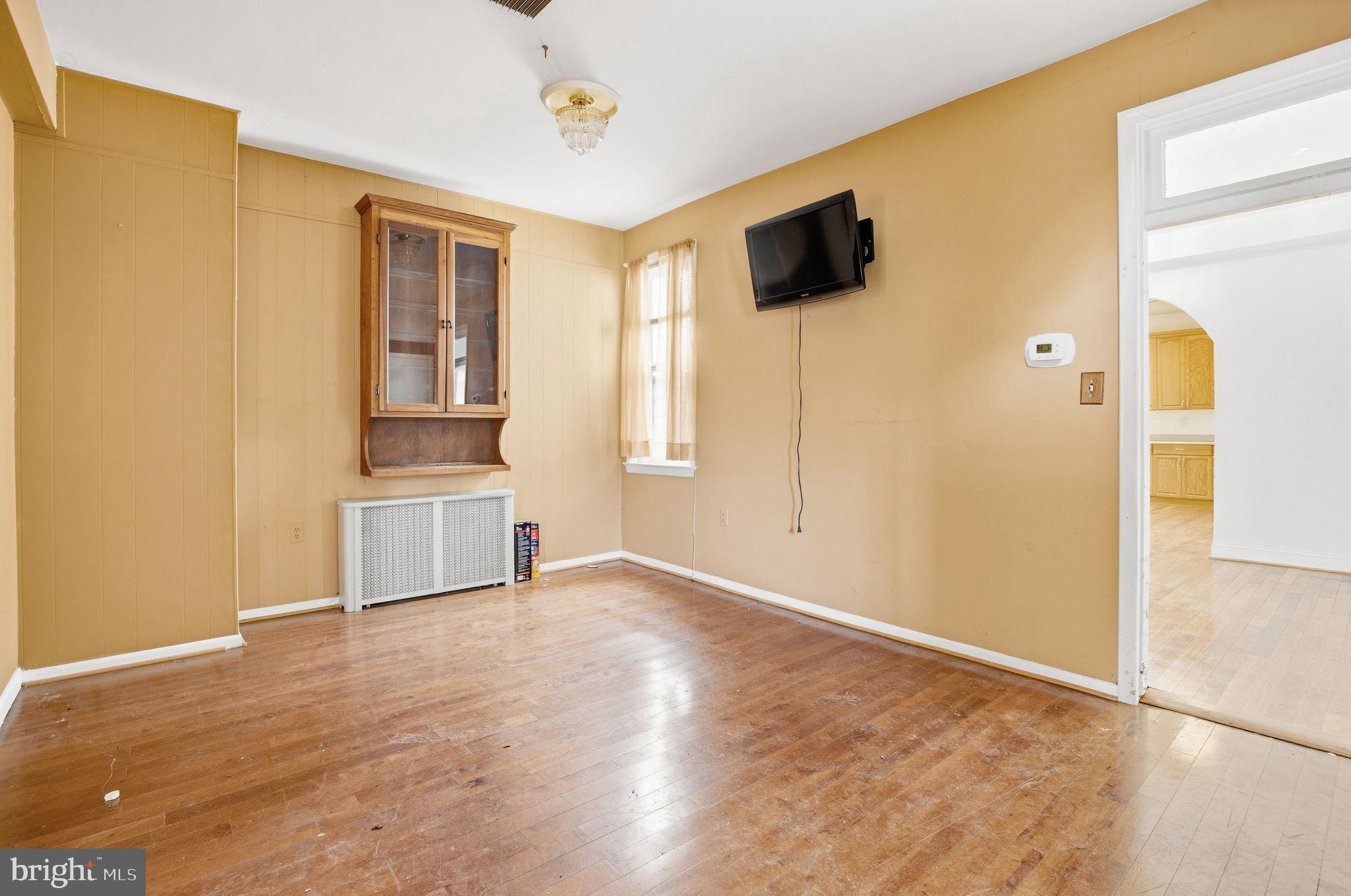 1346 Franklin Street Northeast Washington, DC 20017 - Photo 4 of 50 a view of empty room with wooden floor and windows