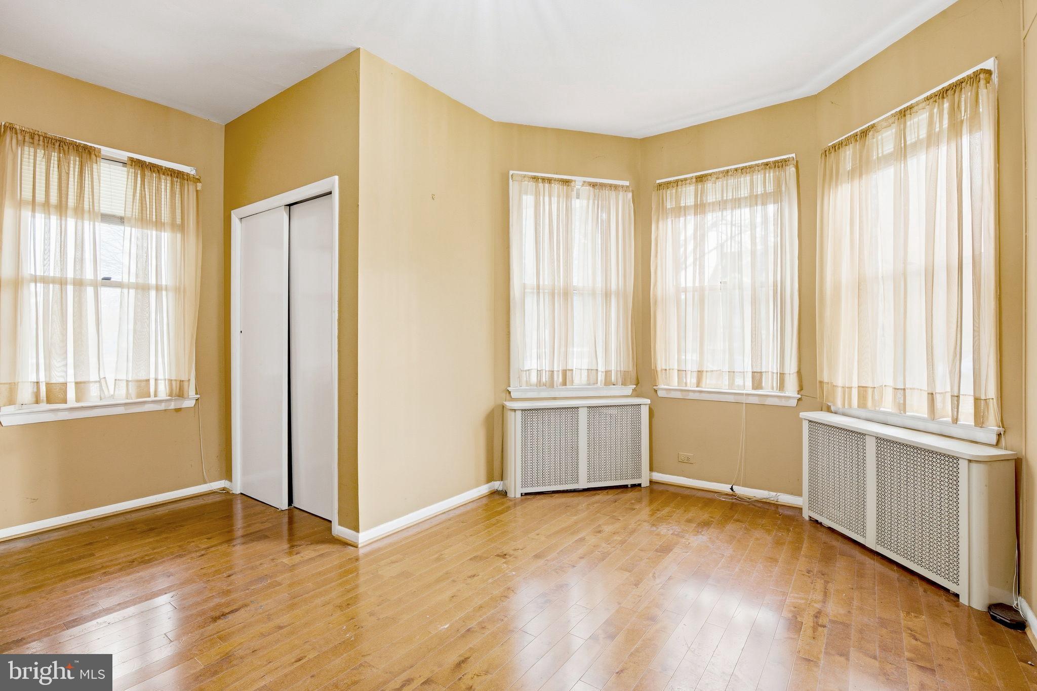 1346 Franklin Street Northeast Washington, DC 20017 - Photo 7 of 50 a view of an empty room with a window and wooden floor