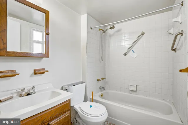 a bathroom with a sink a toilet and a bathtub