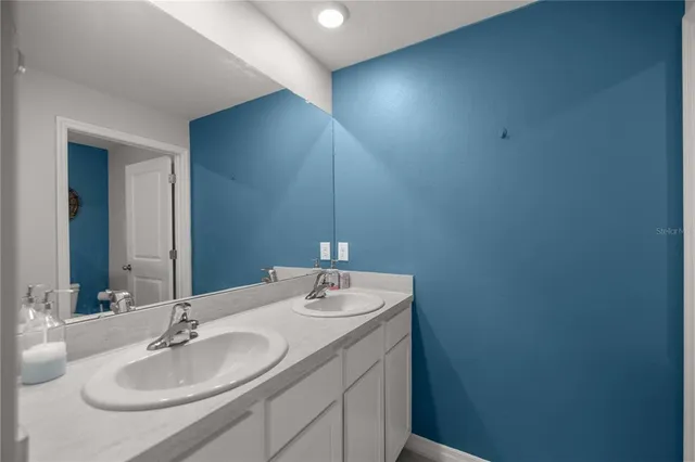 a bathroom with a toilet and a shower curtain