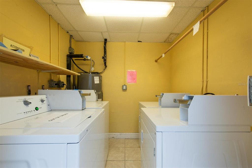16333 Gulf Boulevard, Unit 201 Redington Beach, FL 33708 - Photo 11 of 39 a utility room with dryer and washer