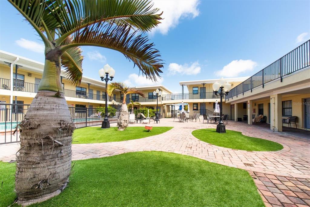 16333 Gulf Boulevard, Unit 201 Redington Beach, FL 33708 - Photo 12 of 39 a view of a house with swimming pool and sitting area