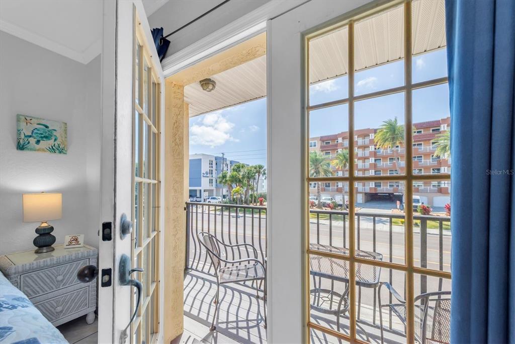 16333 Gulf Boulevard, Unit 201 Redington Beach, FL 33708 - Photo 22 of 39 a very nice looking room with a large window and a bed
