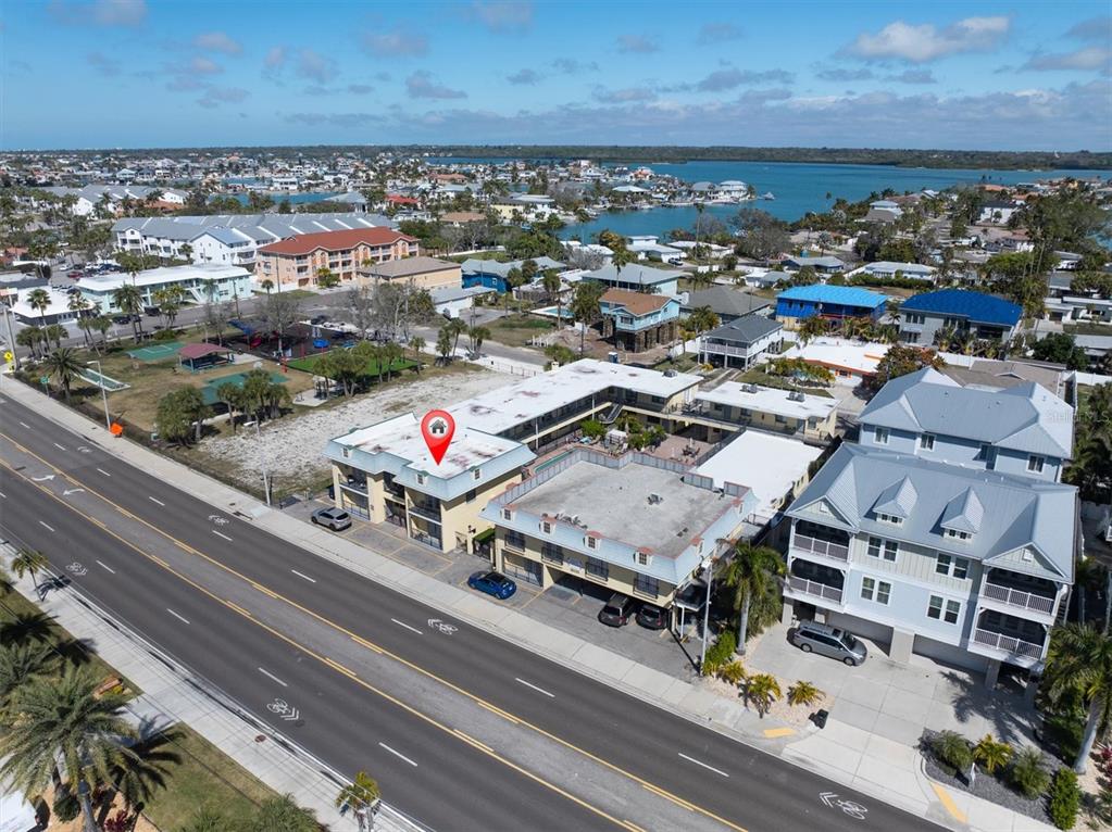16333 Gulf Boulevard, Unit 201 Redington Beach, FL 33708 - Photo 3 of 39 an aerial view of multiple house