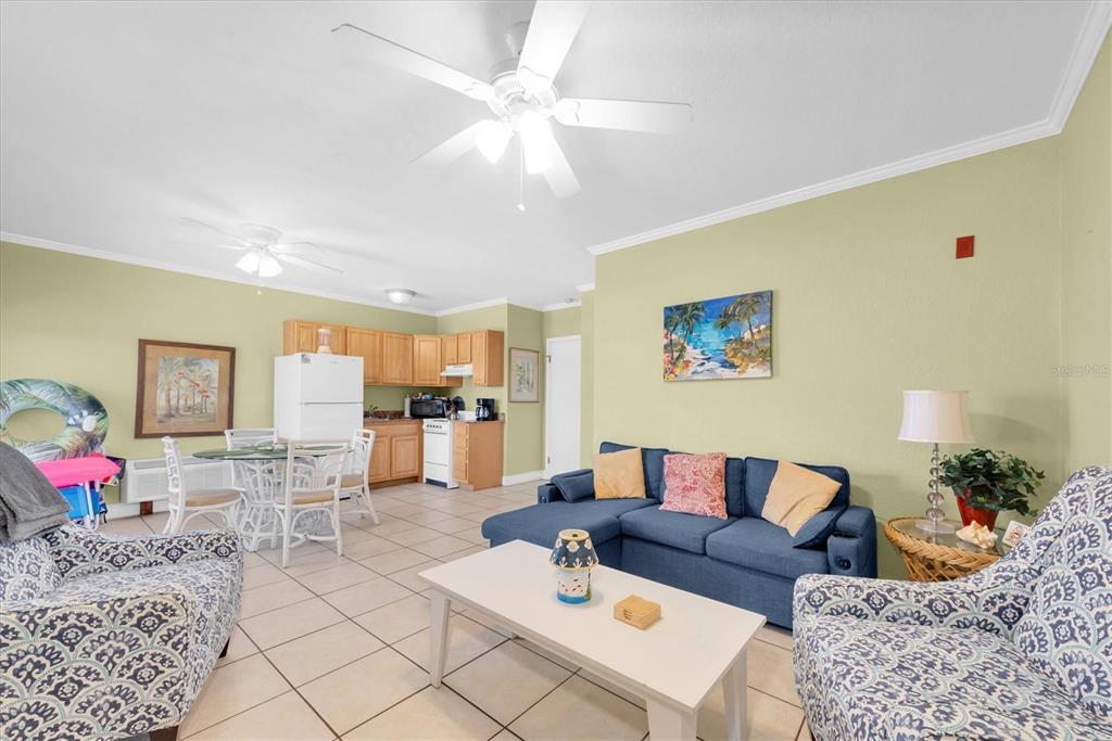 16333 Gulf Boulevard, Unit 201 Redington Beach, FL 33708 - Photo 32 of 39 a living room with furniture and wooden floor