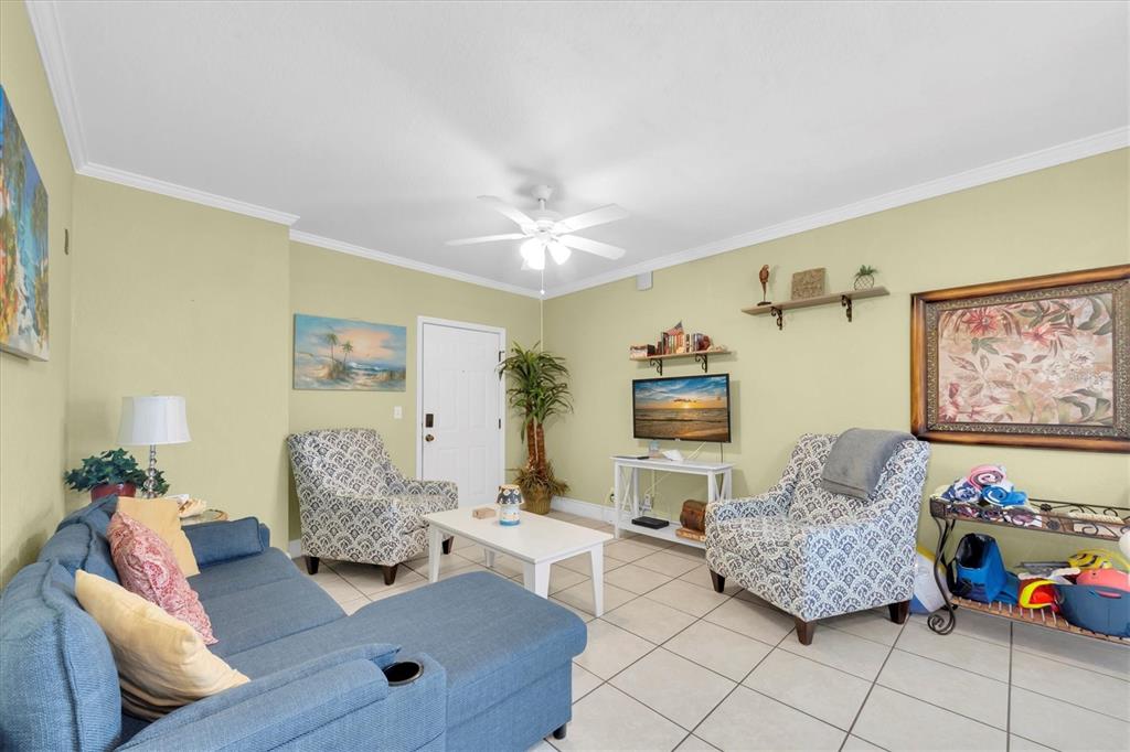 16333 Gulf Boulevard, Unit 201 Redington Beach, FL 33708 - Photo 33 of 39 a living room with furniture and a couch