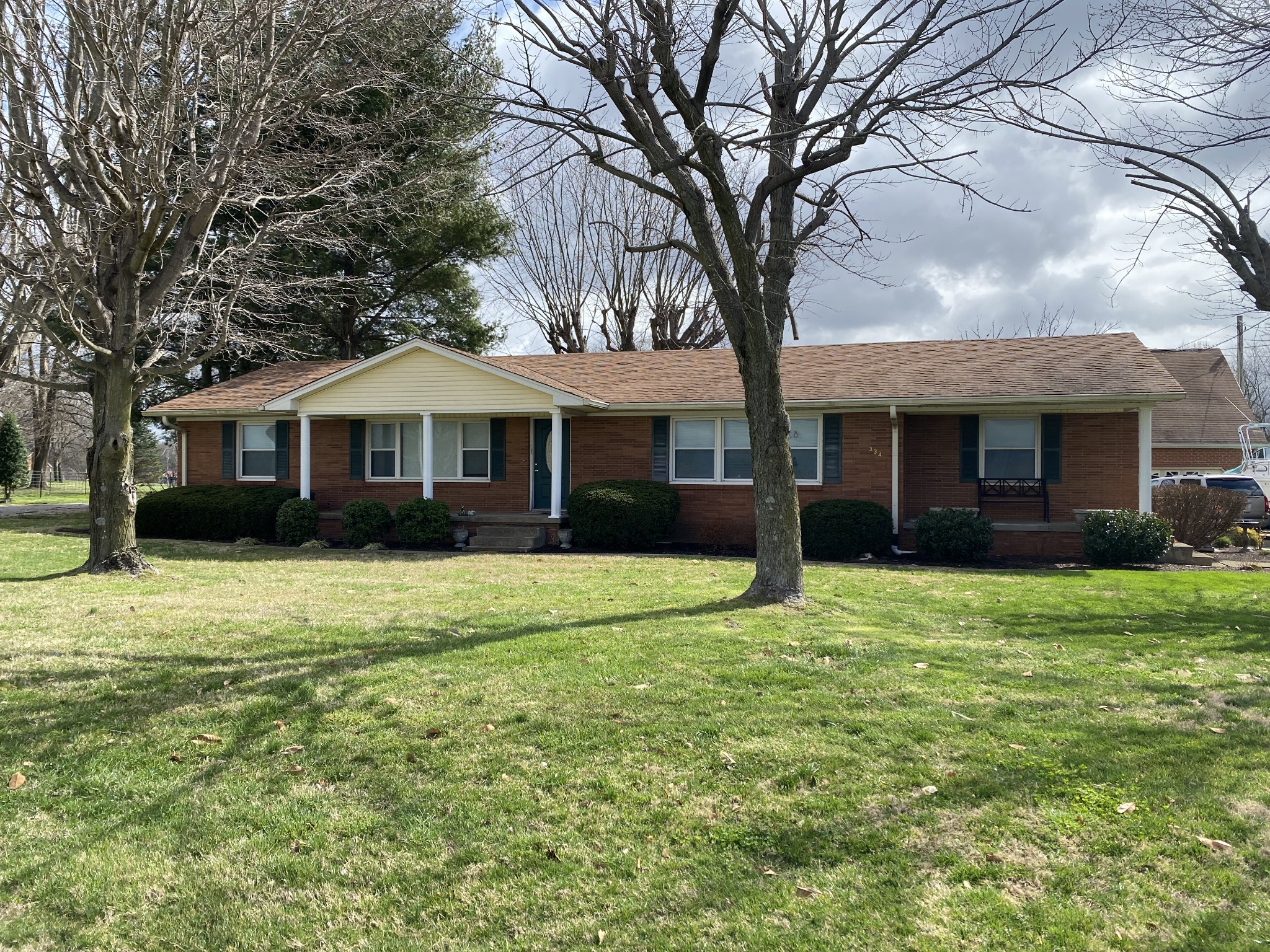 334 Jackson Road Portland, TN 37148 - Photo 1 of 15 a front view of a house with a garden