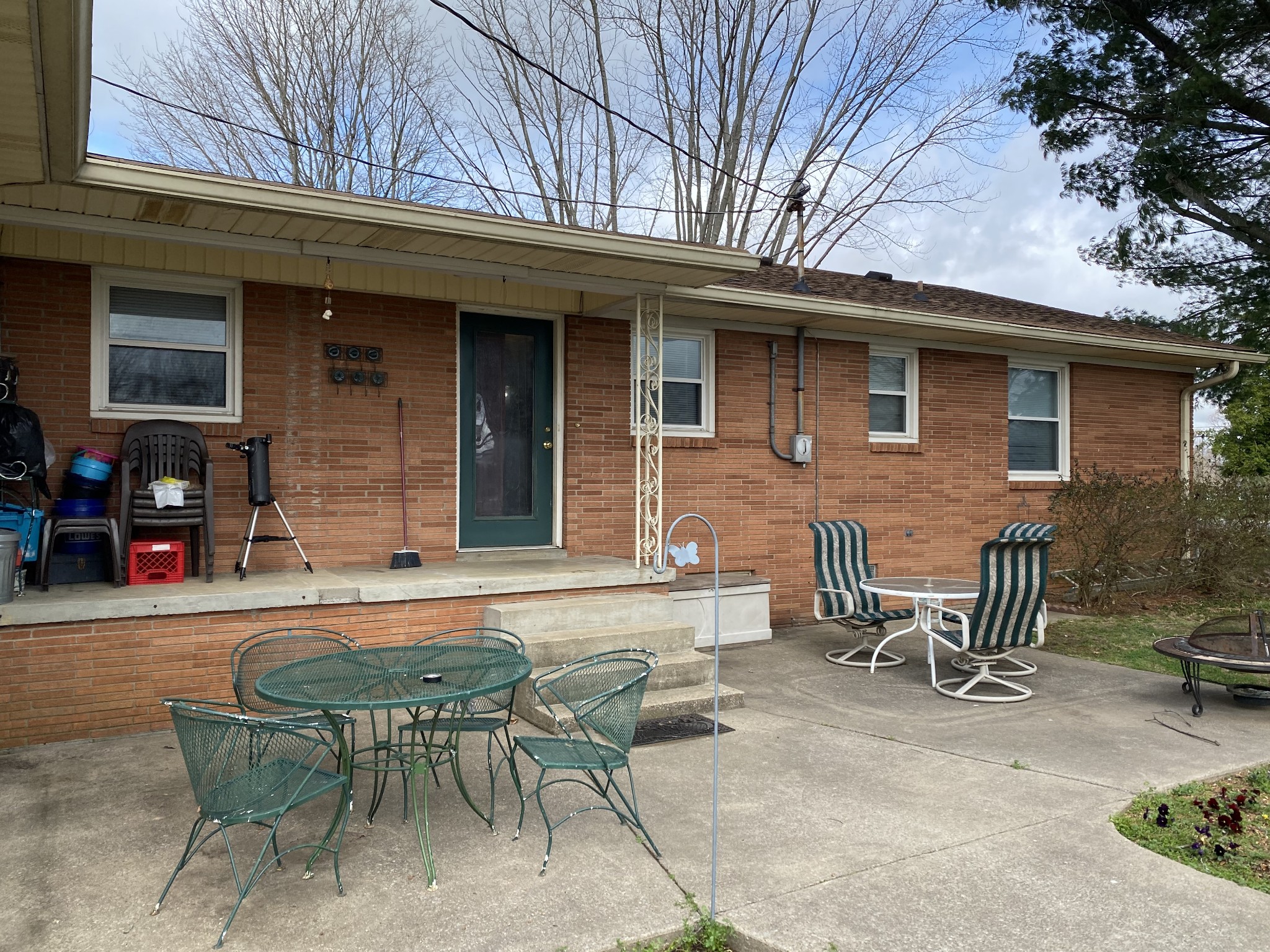 334 Jackson Road Portland, TN 37148 - Photo 14 of 15 a backyard of a house with table and chairs