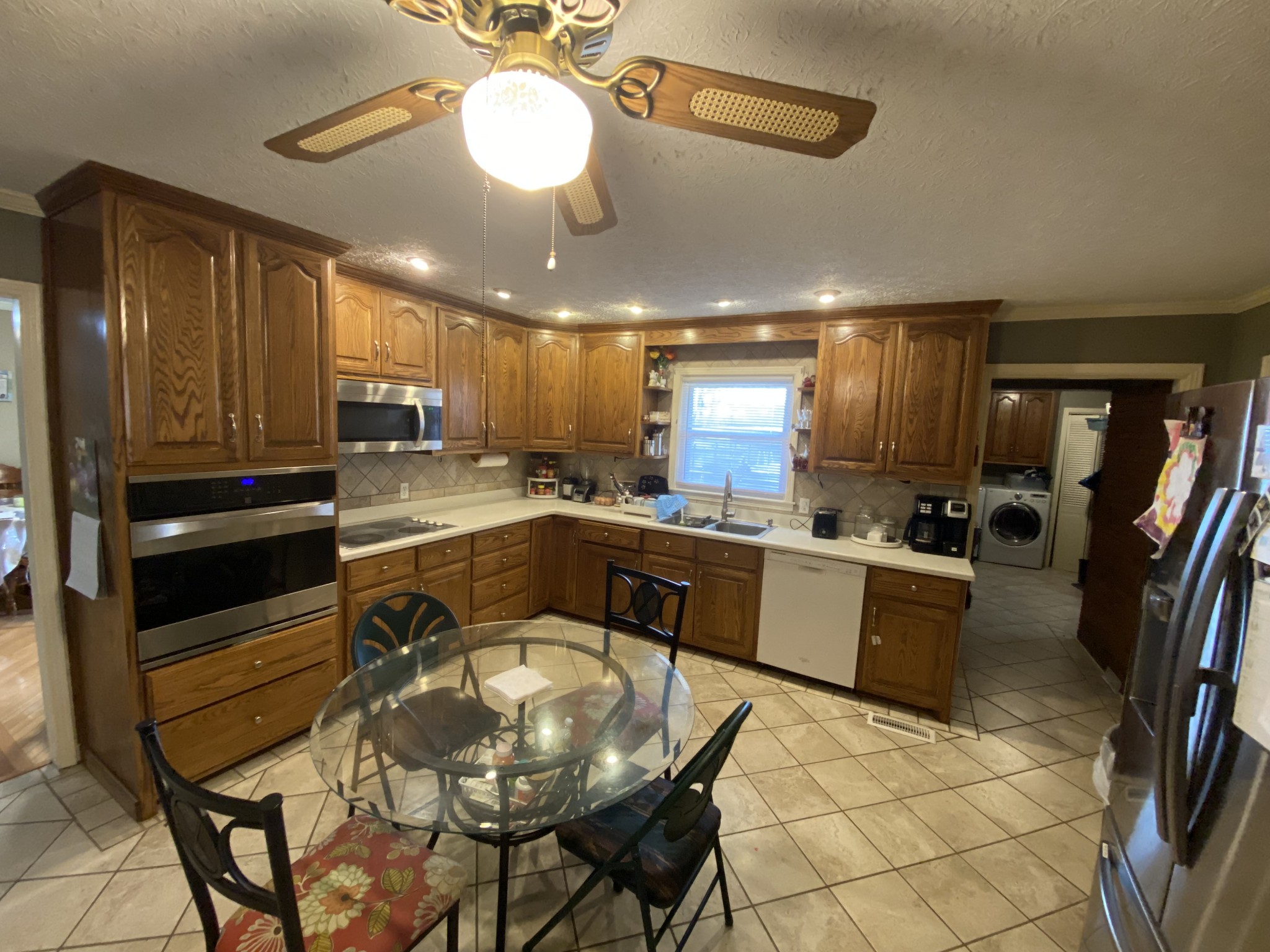 334 Jackson Road Portland, TN 37148 - Photo 5 of 15 a large kitchen with a table and chairs