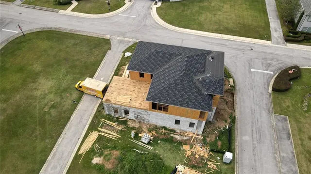 an aerial view of a house having swimming pool