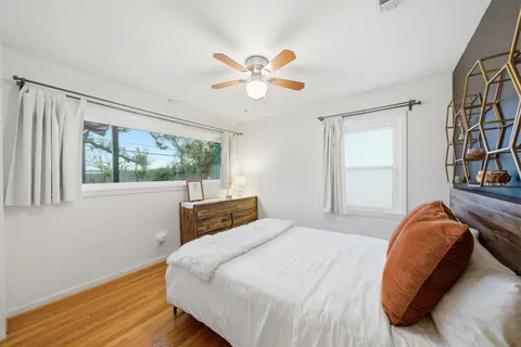 a bedroom with a bed and a window