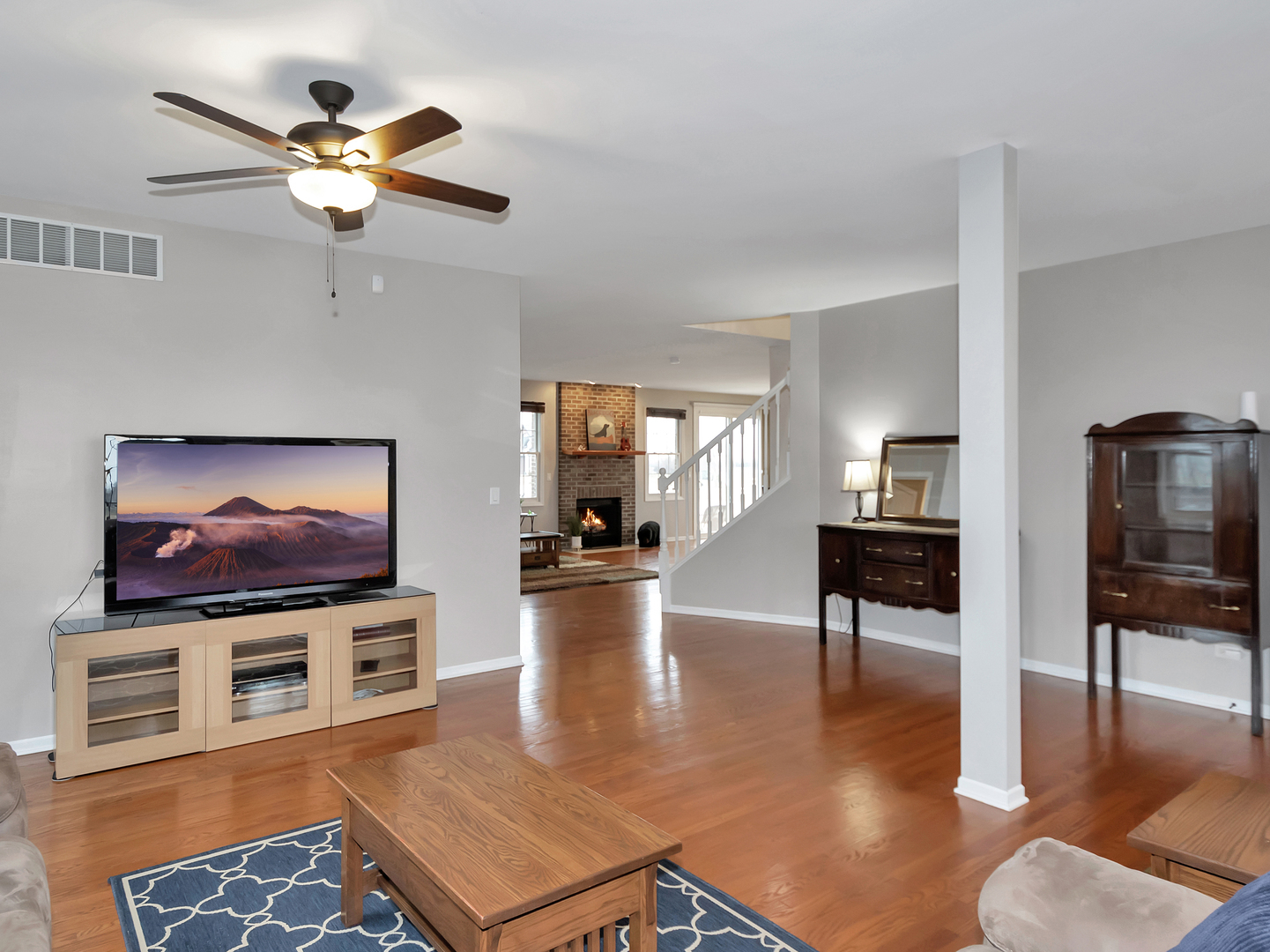 23928 Roberts Street Manhattan, IL 60442 - Photo 11 of 36 a living room with furniture and a flat screen tv