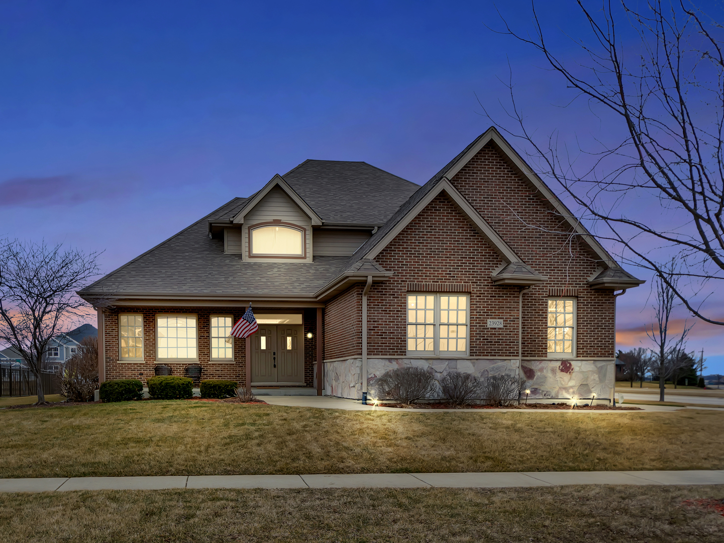 23928 Roberts Street Manhattan, IL 60442 - Photo 2 of 36 a front view of a house with a yard