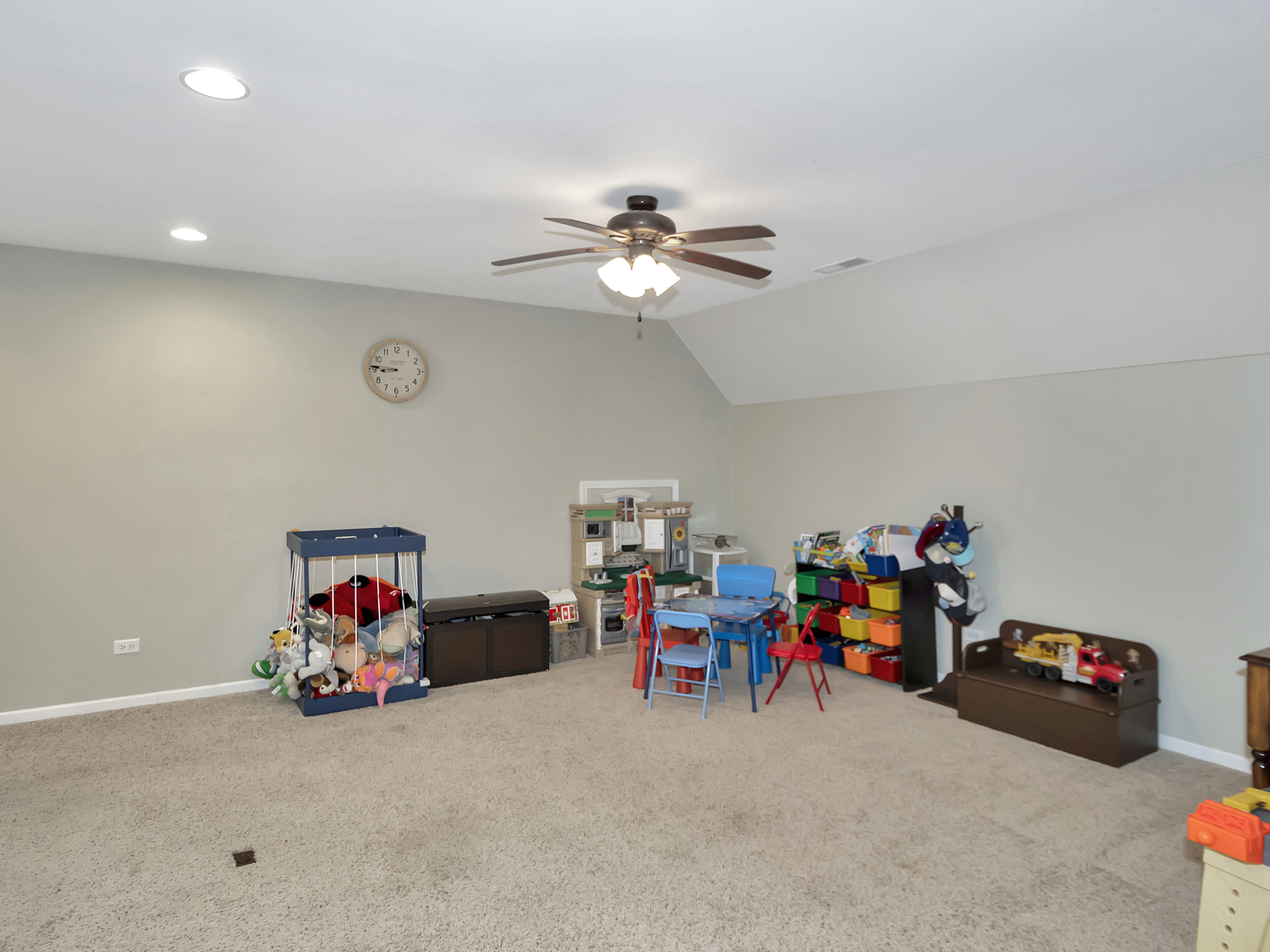23928 Roberts Street Manhattan, IL 60442 - Photo 27 of 36 a view of a room with toys and a chandelier