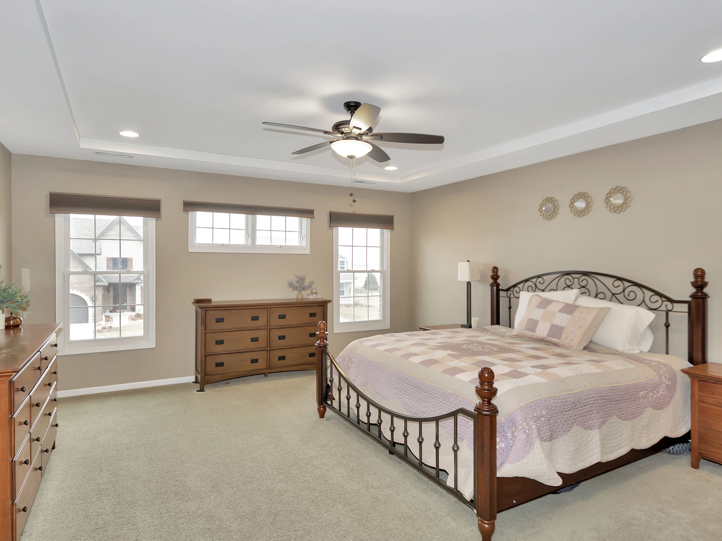 23928 Roberts Street Manhattan, IL 60442 - Photo 28 of 36 a bedroom with a bed and a chandelier