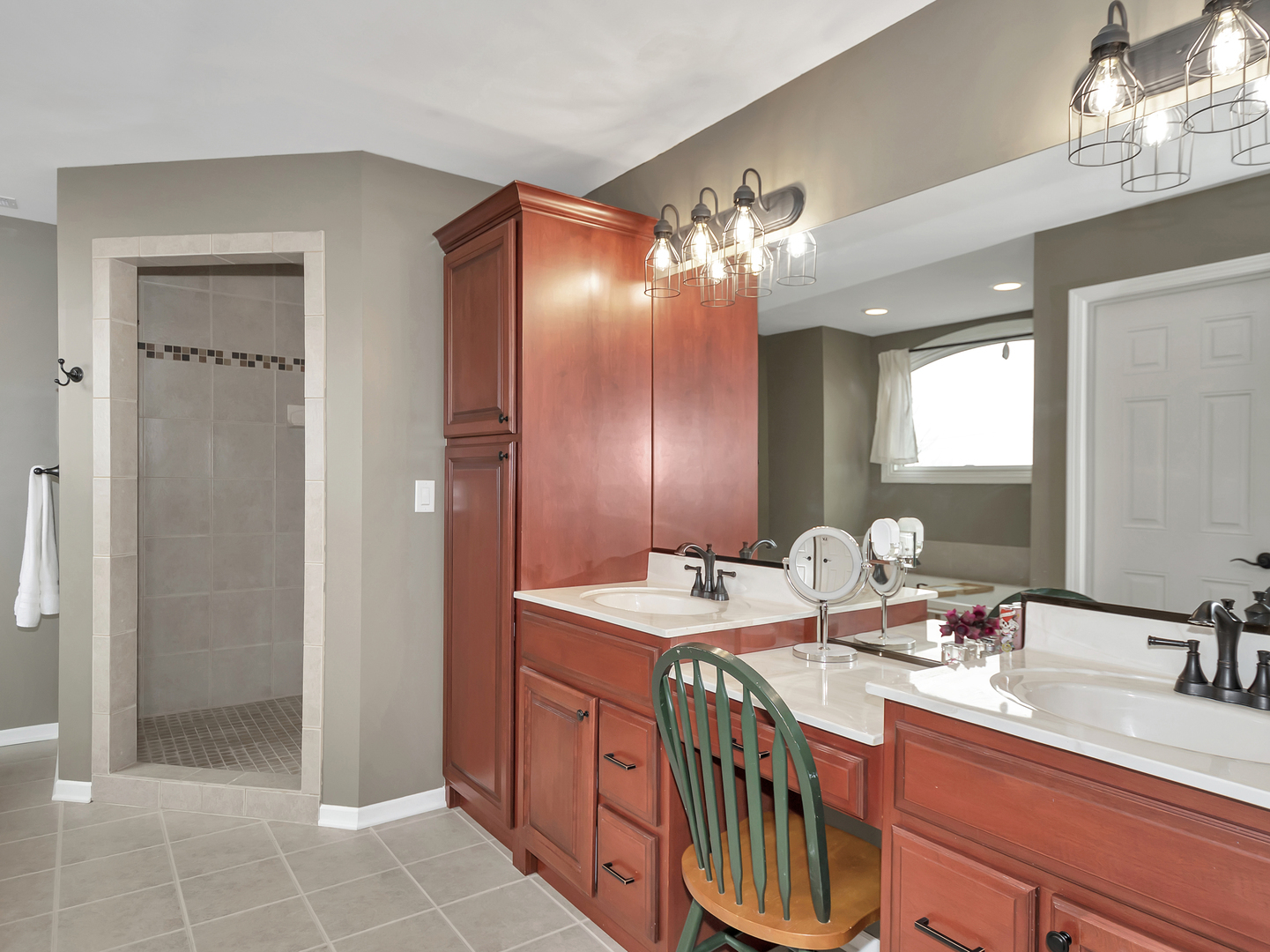 23928 Roberts Street Manhattan, IL 60442 - Photo 29 of 36 a bathroom with double sink and a mirror