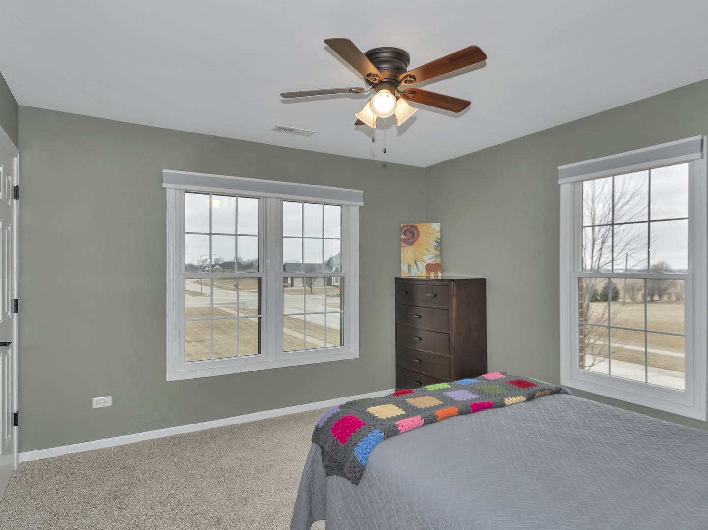 23928 Roberts Street Manhattan, IL 60442 - Photo 34 of 36 a bedroom with a bed and a window