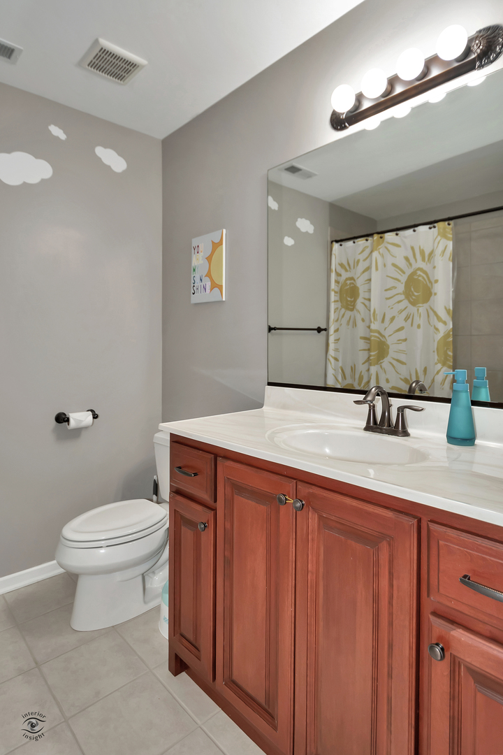 23928 Roberts Street Manhattan, IL 60442 - Photo 36 of 36 a bathroom with a sink a toilet and mirror