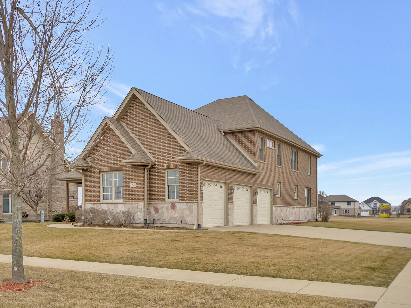 23928 Roberts Street Manhattan, IL 60442 - Photo 5 of 36 a front view of a house with a yard