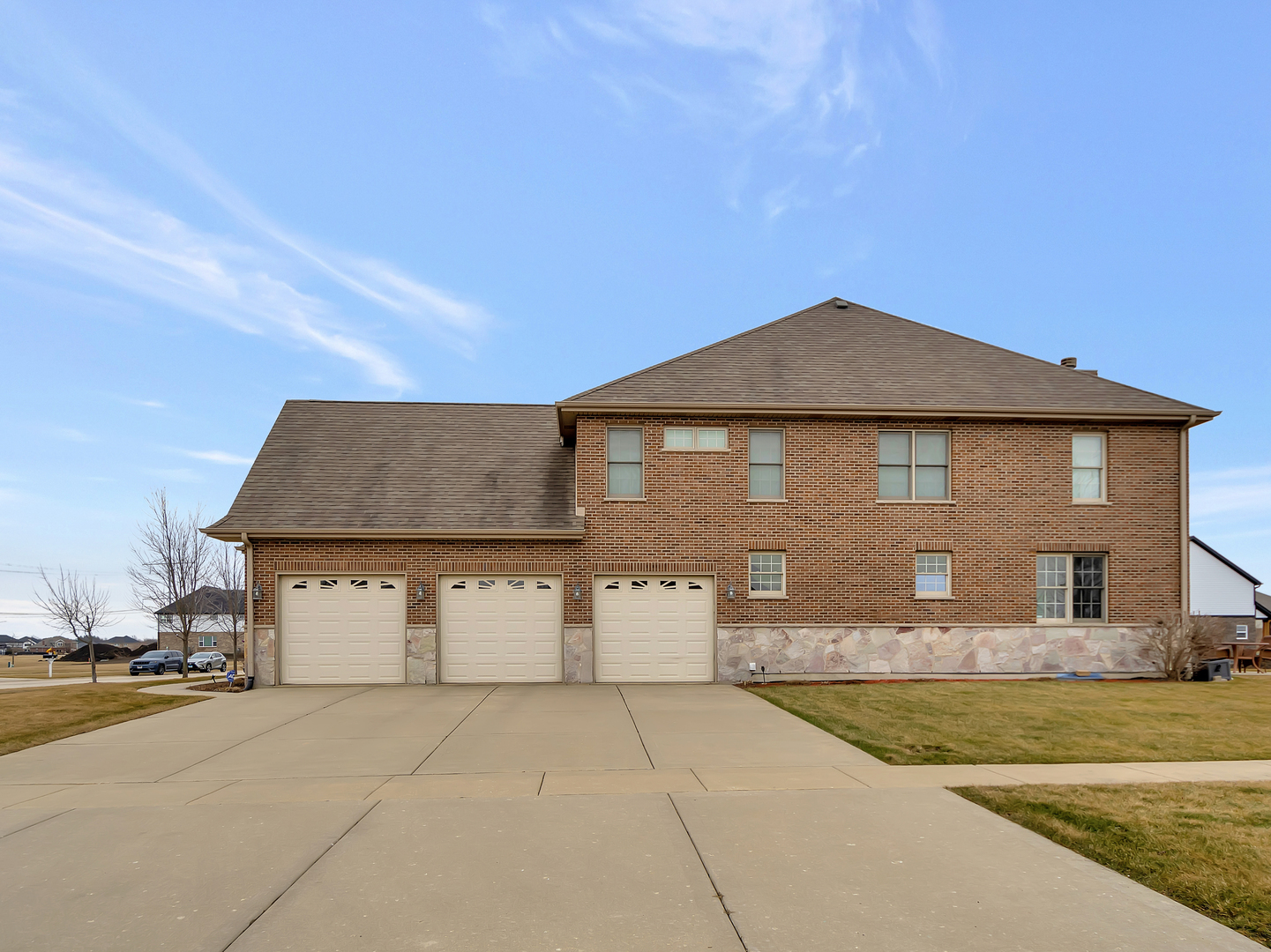 23928 Roberts Street Manhattan, IL 60442 - Photo 6 of 36 a front view of a house with a yard and garage